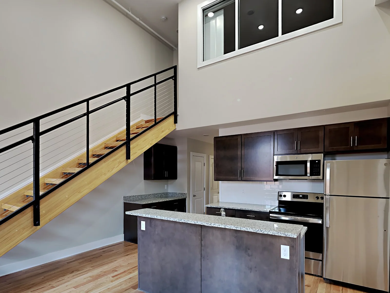 Loft apartment kitchen and open staircase